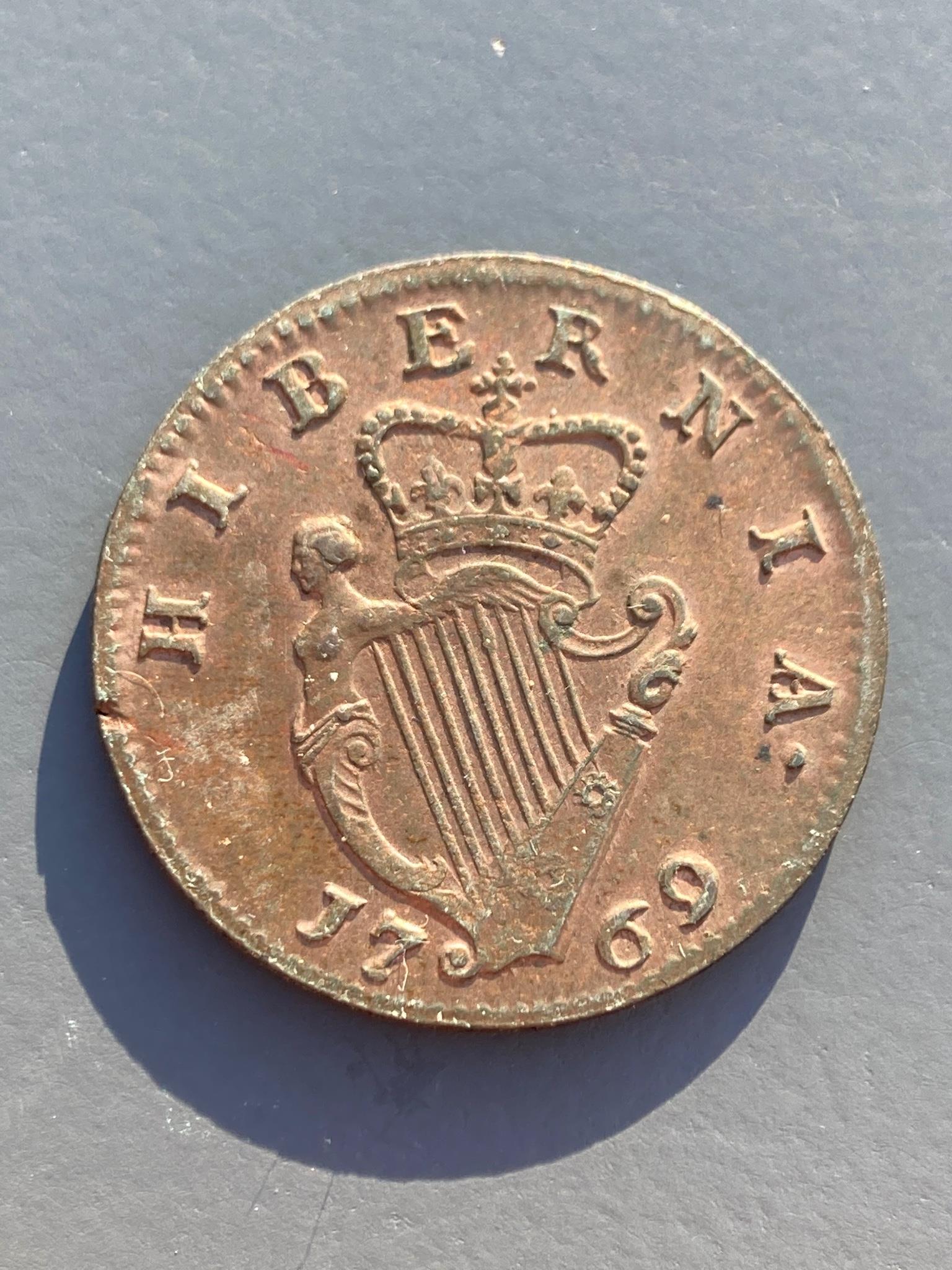 Ireland coins, a George III Halfpenny, 1769, Type II laureate bust with taller head, rev. crowned harp (DF 582; S.6613), tiny edge fault to rev. at 8 o’clock otherwise good VF or better, traces of lustre